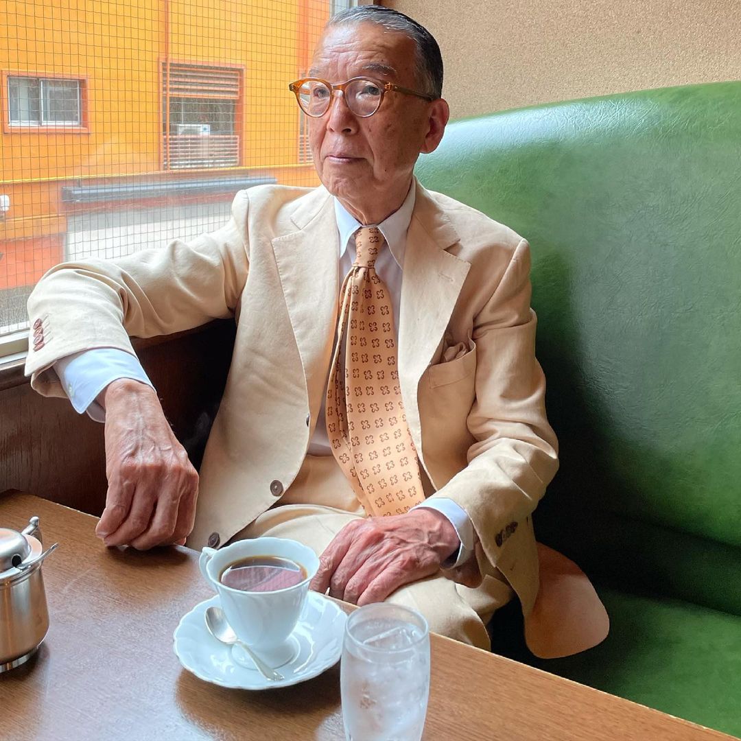 Older Asian Man in Linen Suit